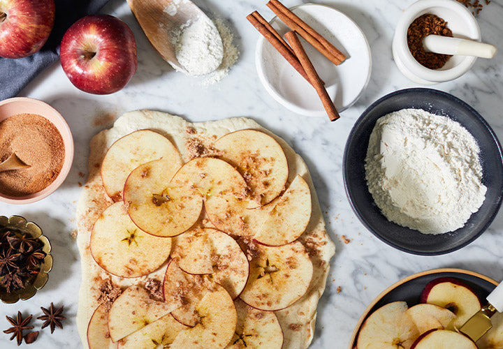 Sliced apples and freshly ground cinnamon going into fresh baked creations.