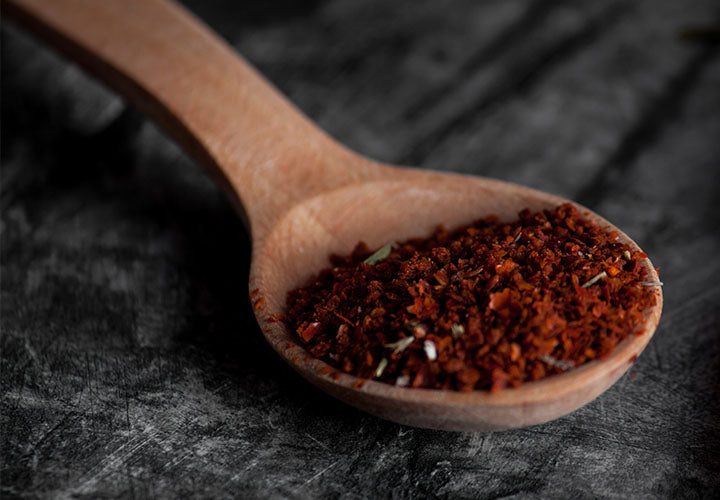 Paprika in a wooden spoon