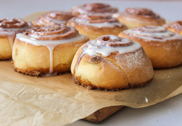 Old-fashioned cinnamon rolls on parchment paper