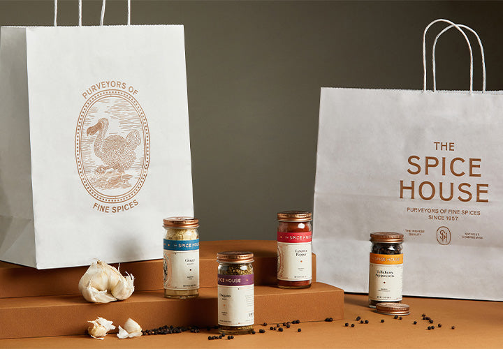 Small batch spices in attractive jars with a stylish shopping bag for sale.