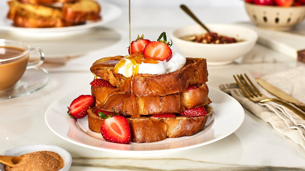 french toast topped with strawberries & whipped cream