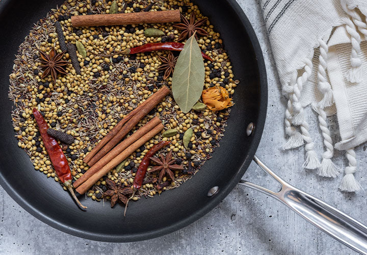 toasting whole cloves in skillet golden brown