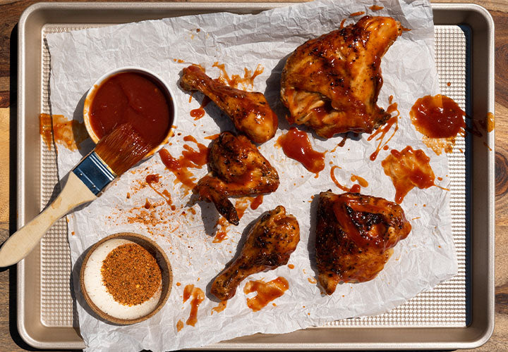 Chicken with Barbecue sauce on a baking sheet